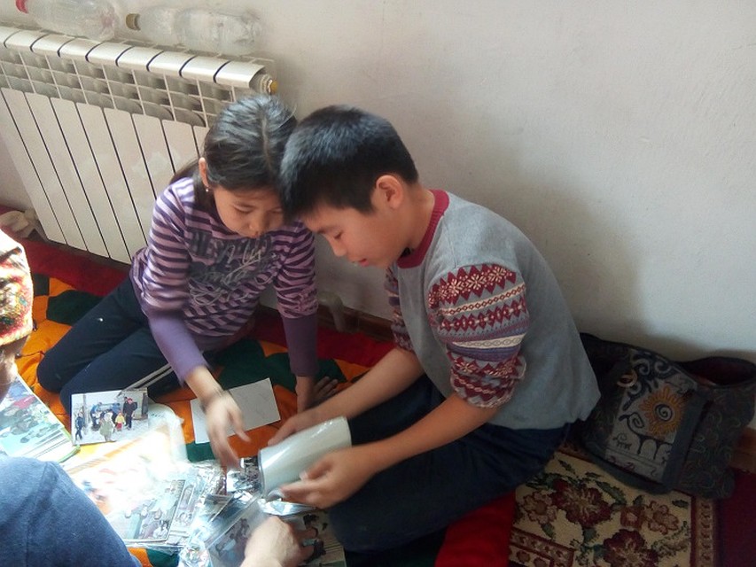 Children often watch family photo album